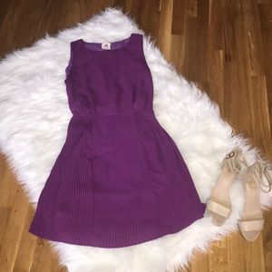 grape dress with opening in back & pleated skirt